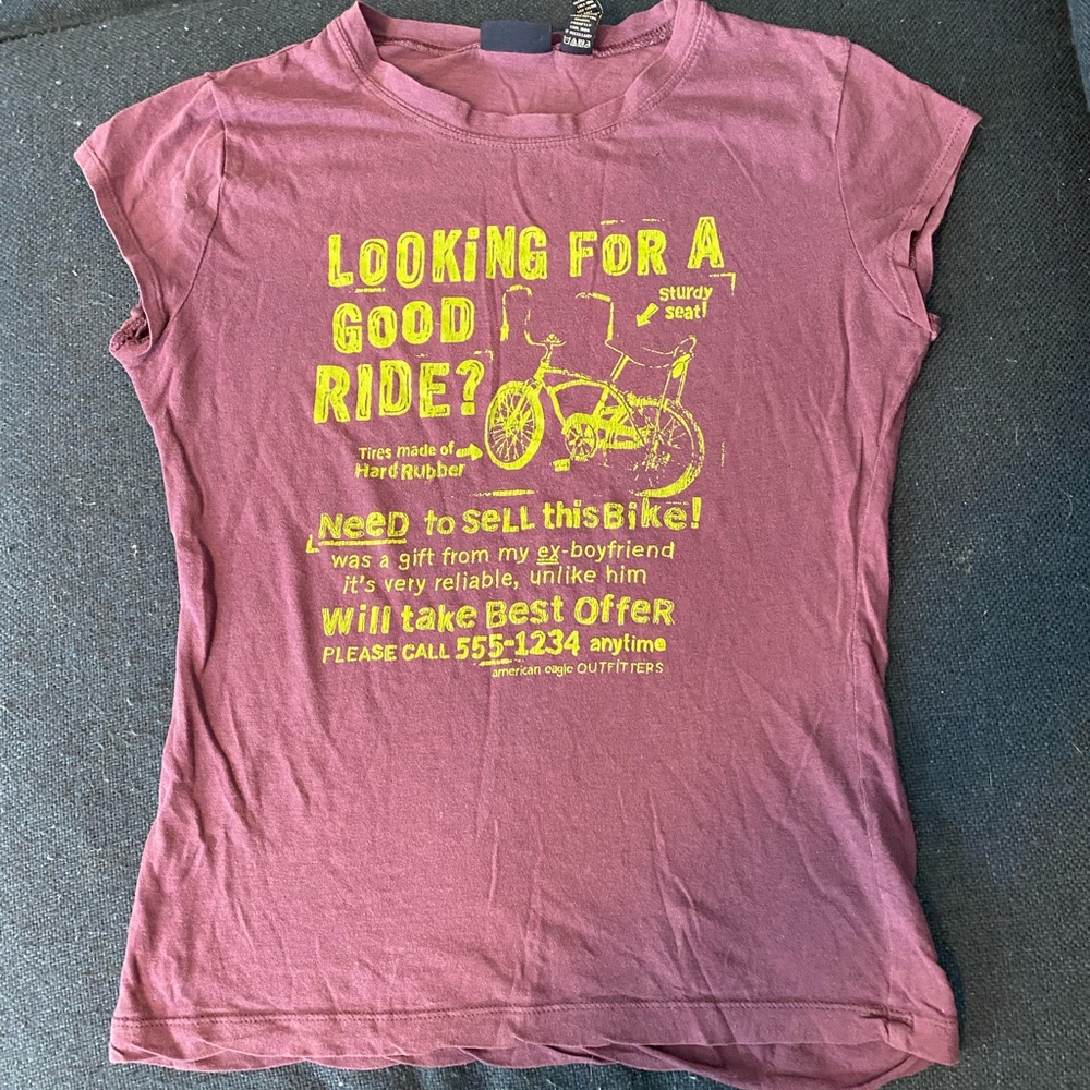 Vintage American Eagle T-shirt. Has a couple tiny holes and hem fraying. Size SP